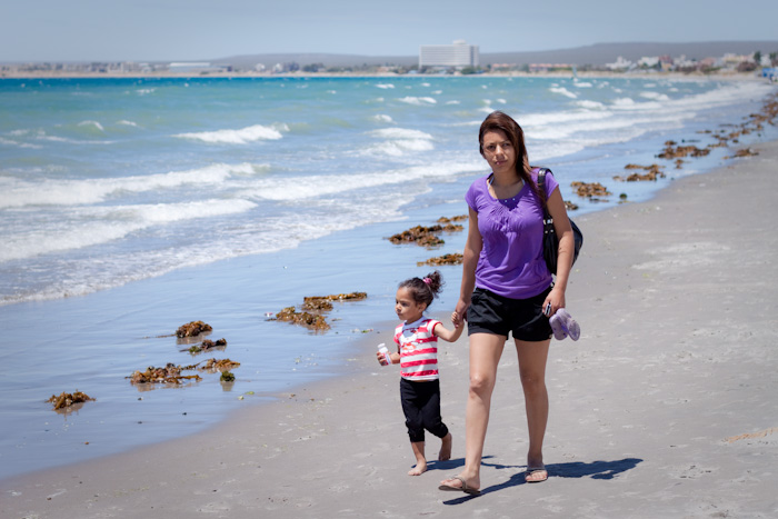 Walkers on the beach, Puerto Madryn, Argentina.