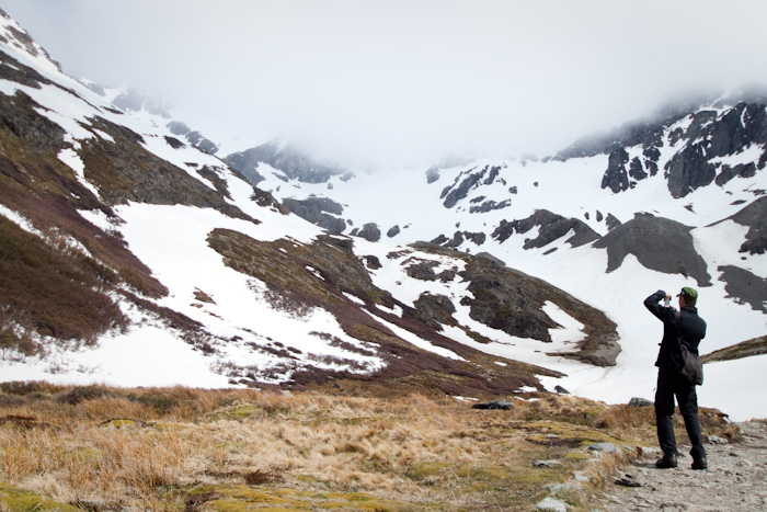 Man taking a photo, Martial Glacier, Teirra del Fuego, Argentina.
