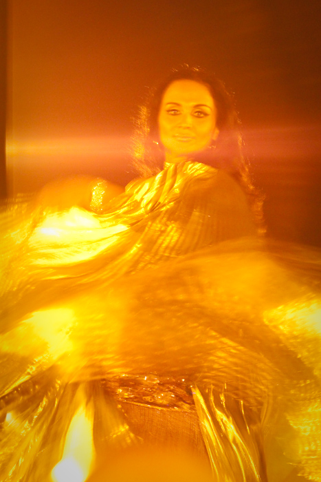 The second show featured a belly dancer. By this time it was really dark. I wish I'd taken my 50mm 1.8 lens, to work better with the low light. But I only had my zoom lenses, so I had to get creative.