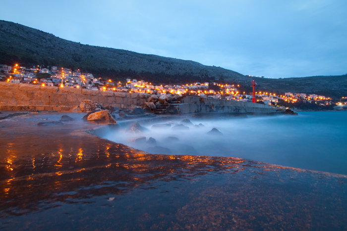 Reflections of street lights add to the effect...  though I got a bit wet in this spot.