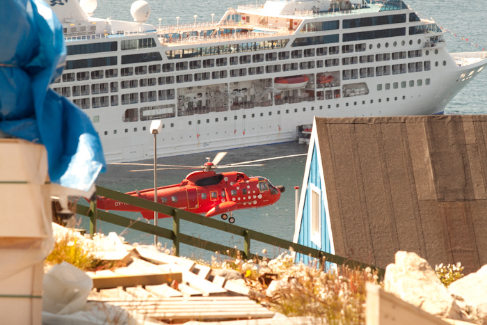 A helicopter flying past the Ocean Princess.