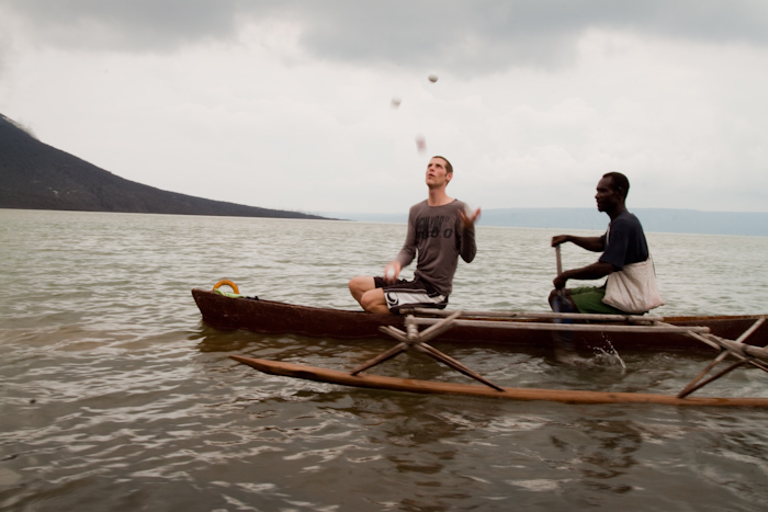 Me juggling in a local's canoe.